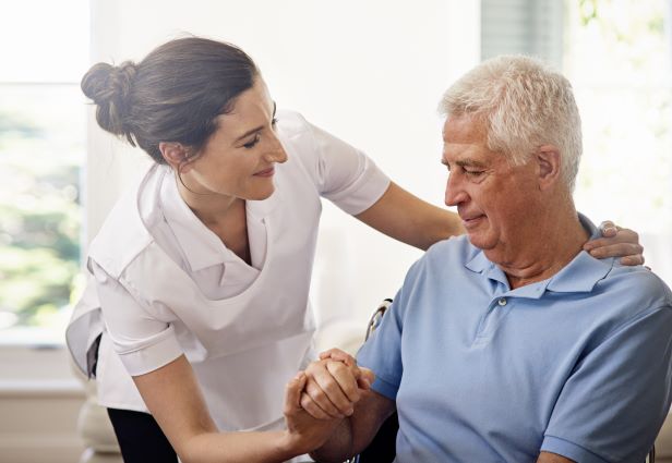 home-care-with-compassion-shot-caregiver-helping-senior-man-wheelchair-home